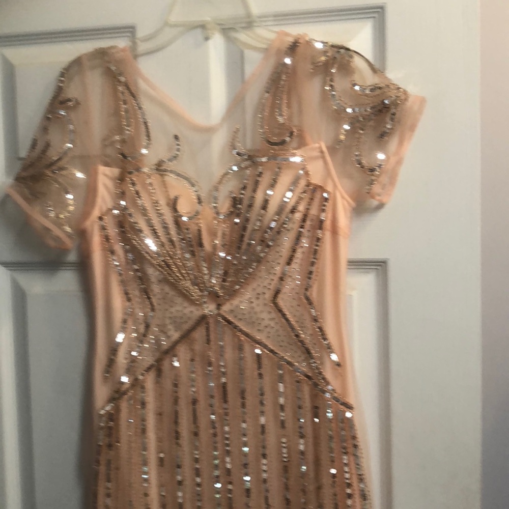 Exquisite piece. Fully beaded formal gown. Size8. No flaws.never worn. Gorgeous